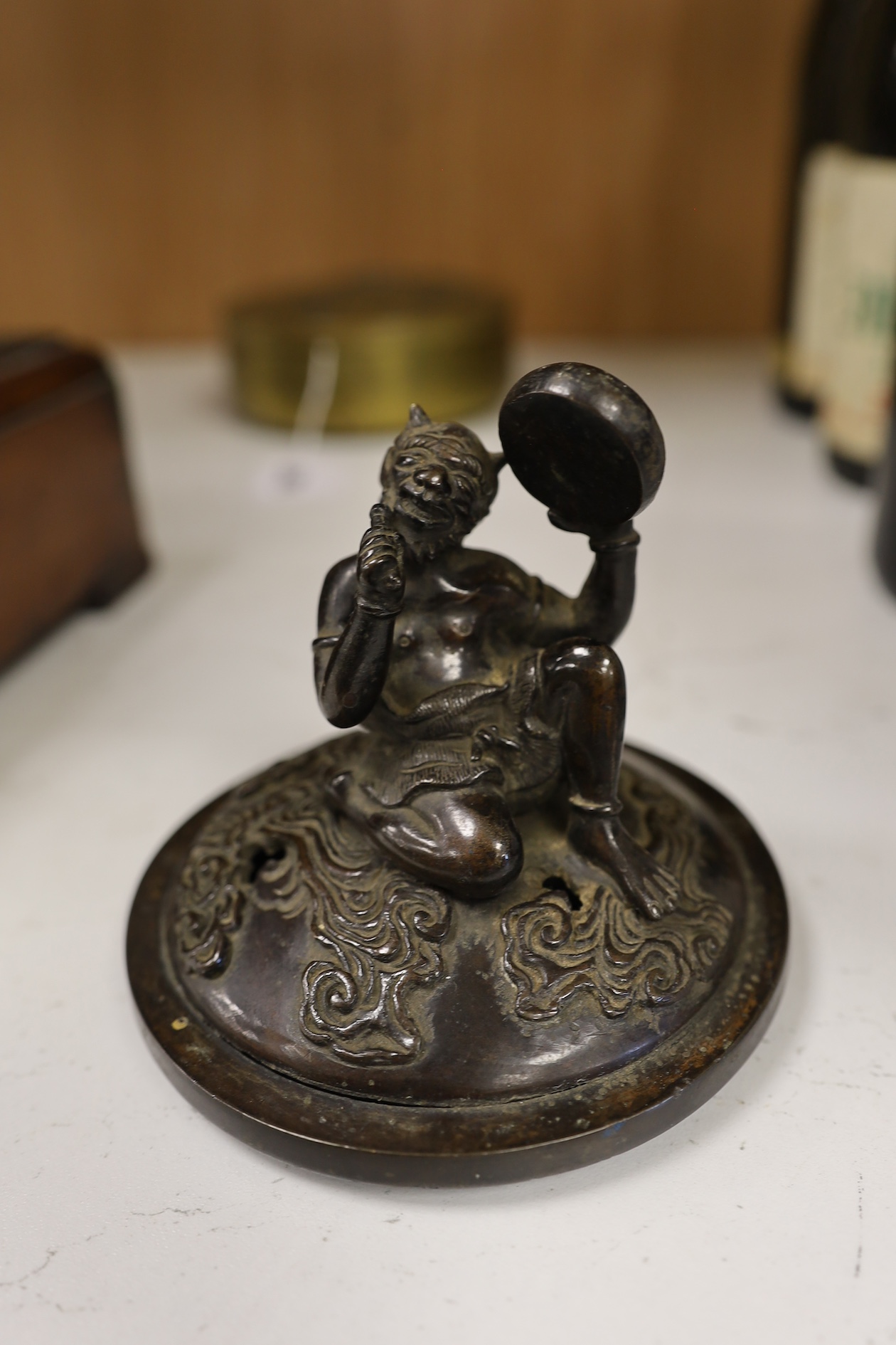 A Japanese bronze dragon handled censer with figural finial to cover, Meiji period, 24cm high. Condition - good